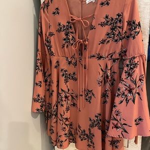 Sexy yet sophisticated mauve toned pink dress with bowties to show off cleavage